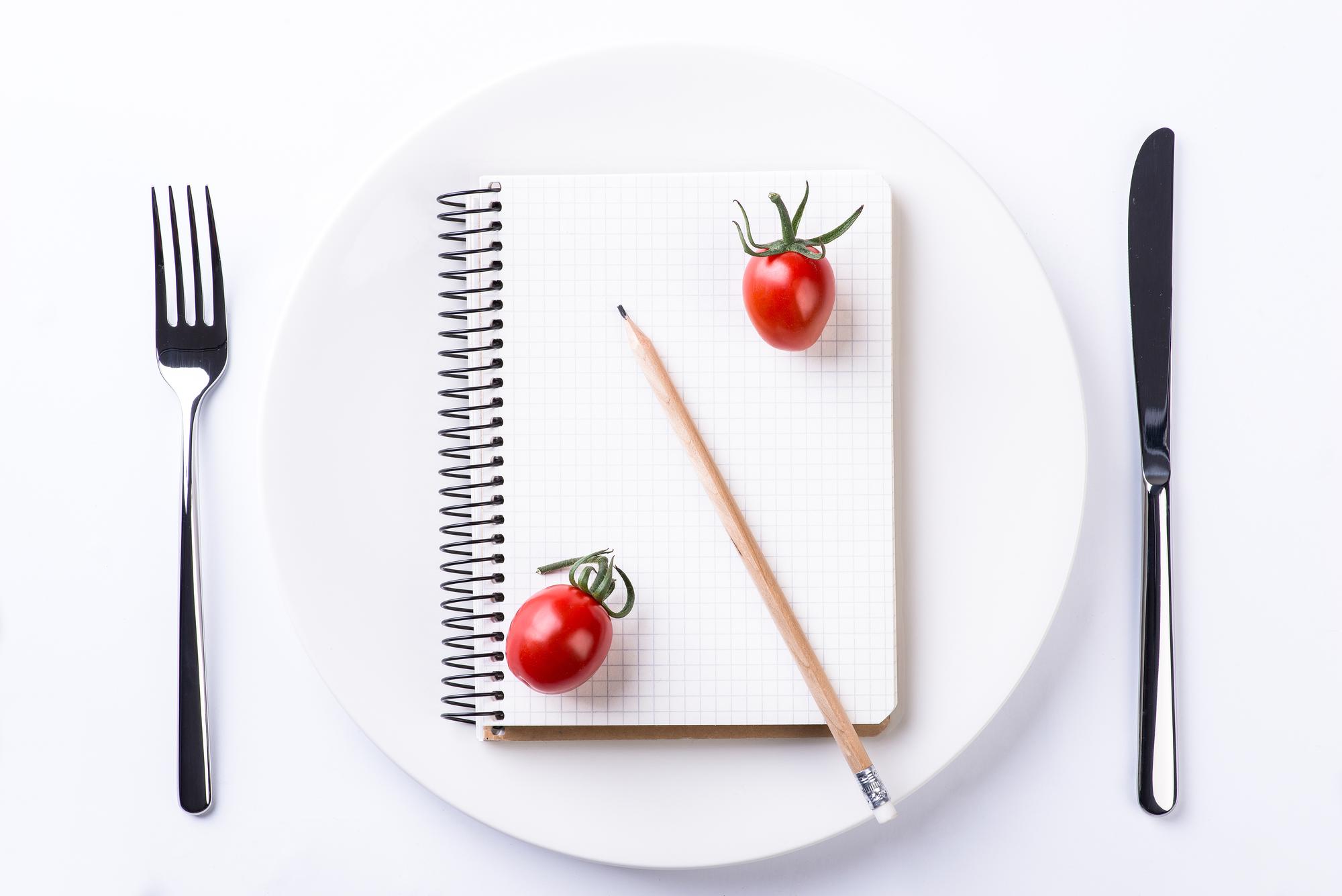 Flatlay of course materials and plated dish